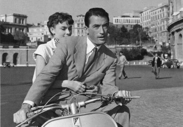 Gregory and Audrey on a Vespa